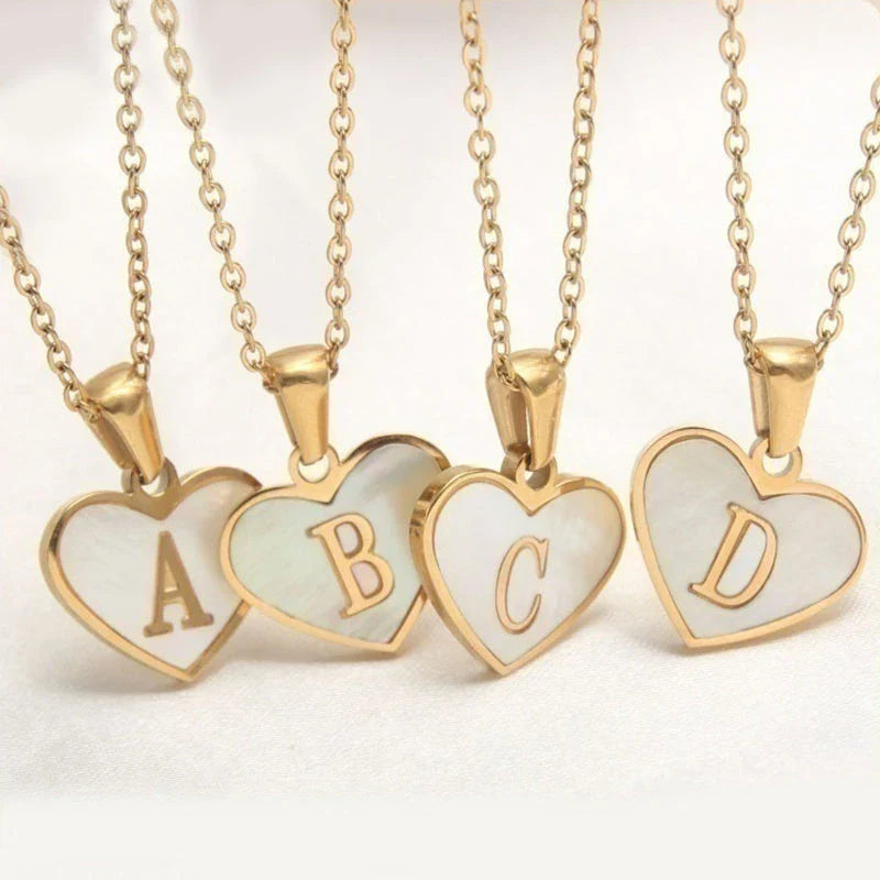 A personalized heart-shaped necklace with a 26-letter charm, crafted from high-quality stainless steel and gold plating.