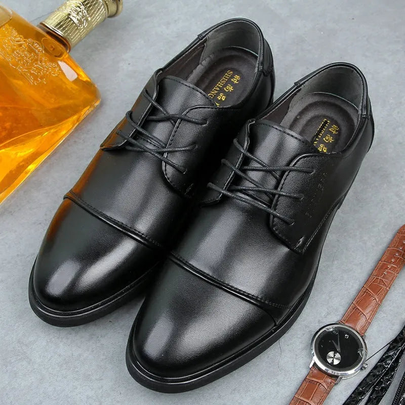 Men's black leather lace-up ankle boot with stitching detail and rubber sole