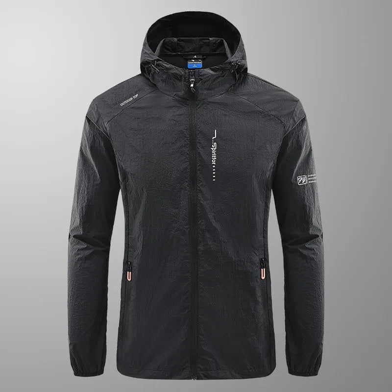 Man wearing a lightweight grey hooded nylon jacket suitable for summer outdoor activities.