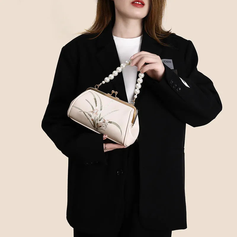 Beige embroidered women's shoulder bag with shell-shaped design in soft PU leather