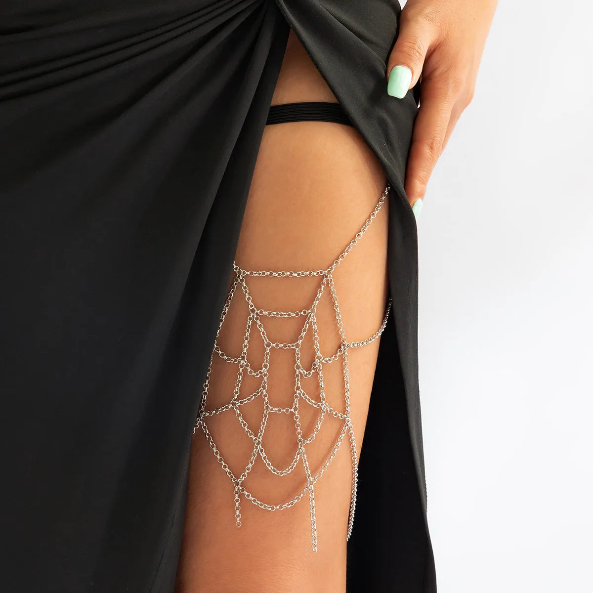 Women's geometric body chain in silver, made from alloy with electroplated finish, shown as an anklet