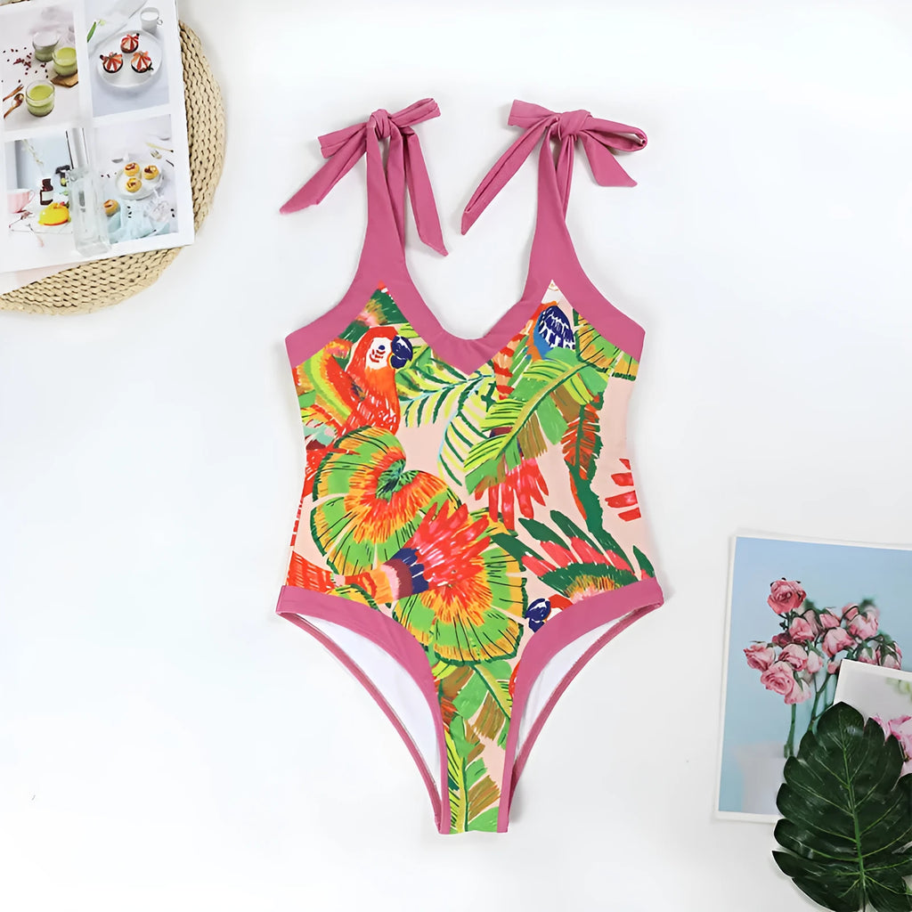 Retro pink floral print one-piece swimsuit with V-neck, thin skirt, and covered belly design.