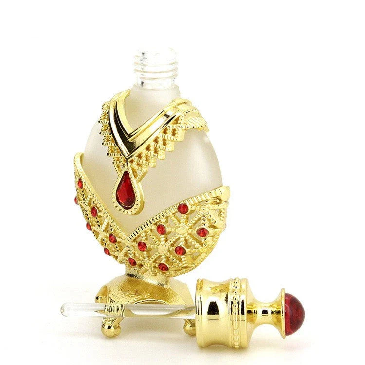 Luxurious perfume oil in a decorative glass bottle, featuring a floral, long-lasting fragrance for confident, radiant wear