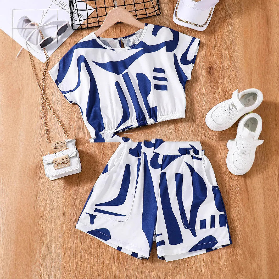 Zebra print short sleeve top and wide leg shorts suit for girls in black and white, side view on hanger