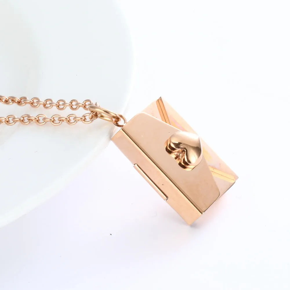 Titanium steel envelope pendant necklace with hidden compartment and O-ring chain