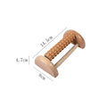 Wooden six-row roller foot massager for acupoint hand massage on a flat surface