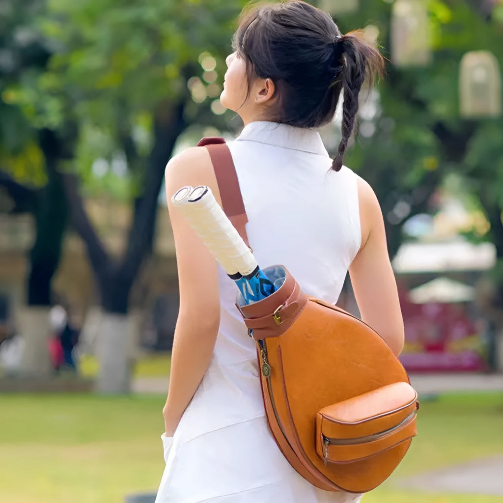 Leather one-shoulder retro badminton bag for women shown in dark brown colour.