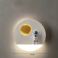 Modern black or white astronaut-shaped wall lamp with integrated shelf and LED light for bedside use.