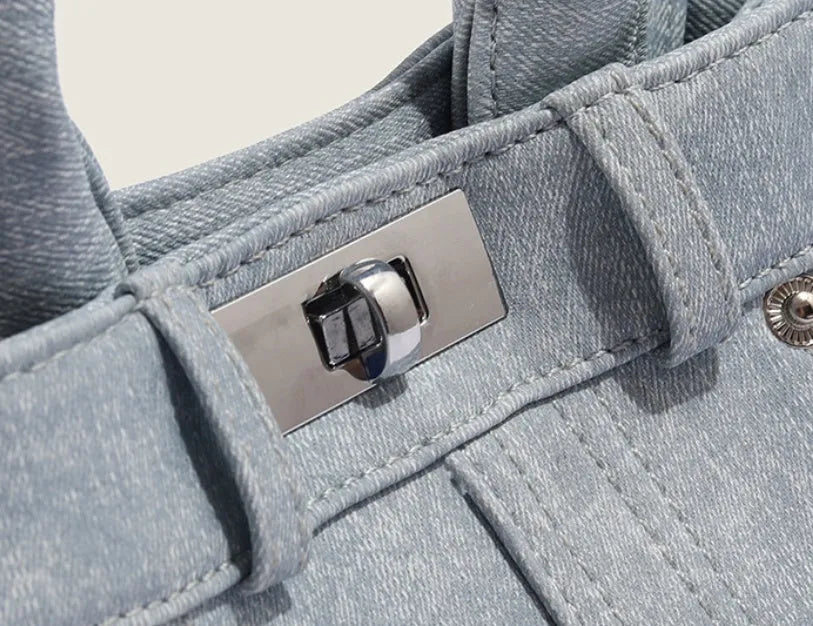 Women's casual shoulder bag made from soft PU material in denim blue colour with standard size dimensions