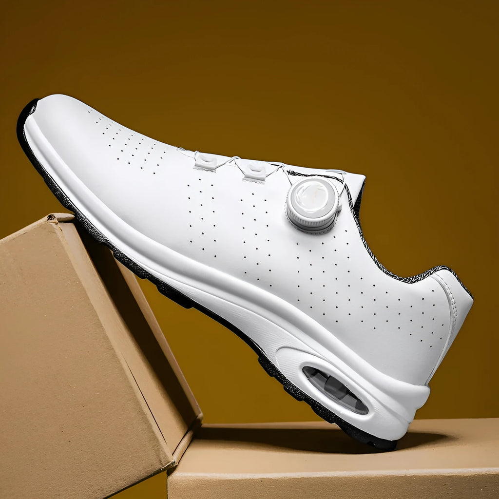 Men's black and white low-top casual tennis shoes with mesh upper and cross shoulder straps