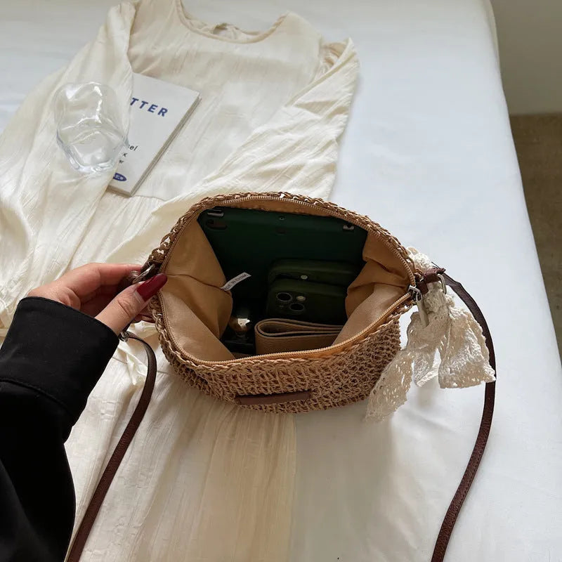 Women's woven straw messenger bag in khaki colour with shoulder strap