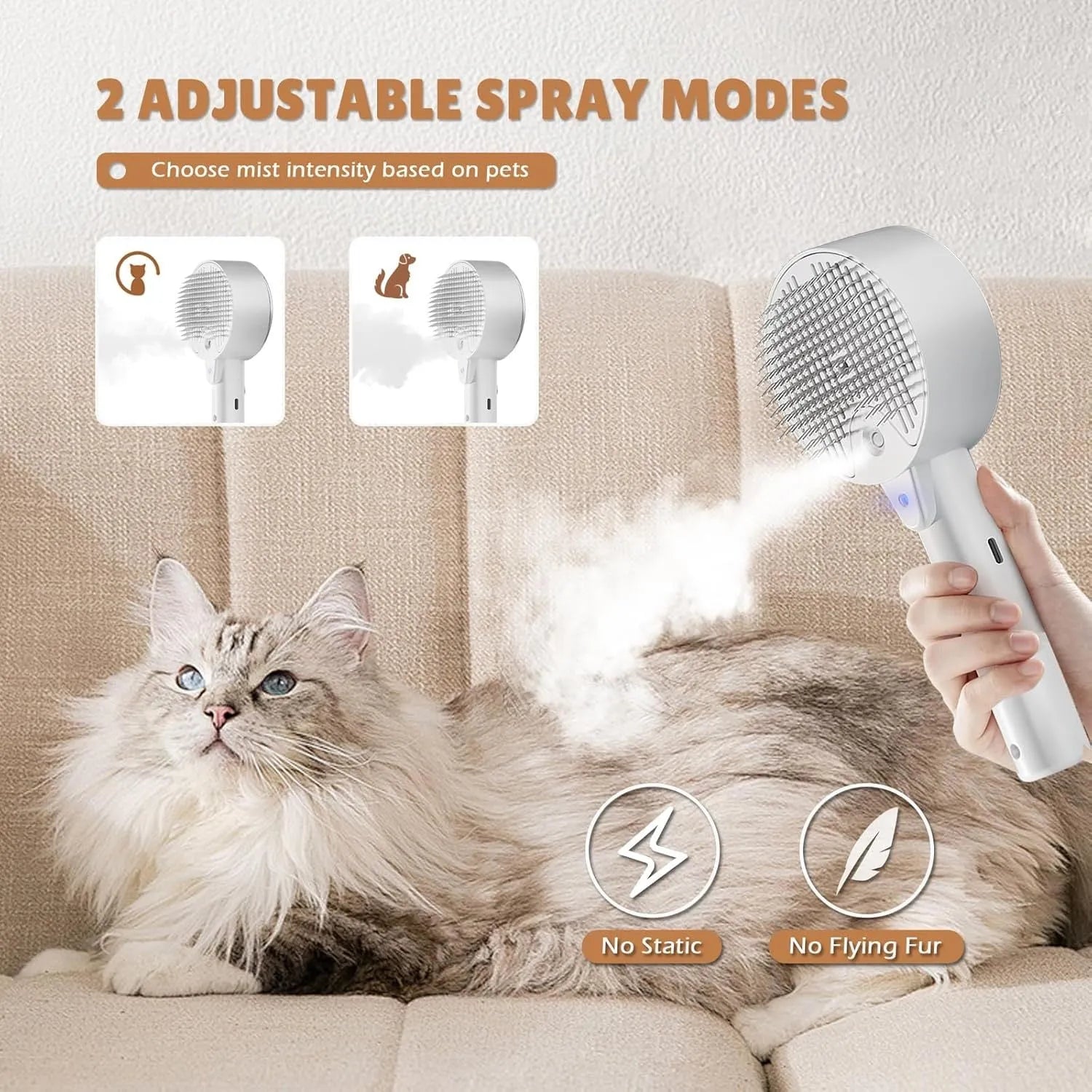 Pink and white cat grooming steam brush with mist function, rounded head, and stainless steel bristles.