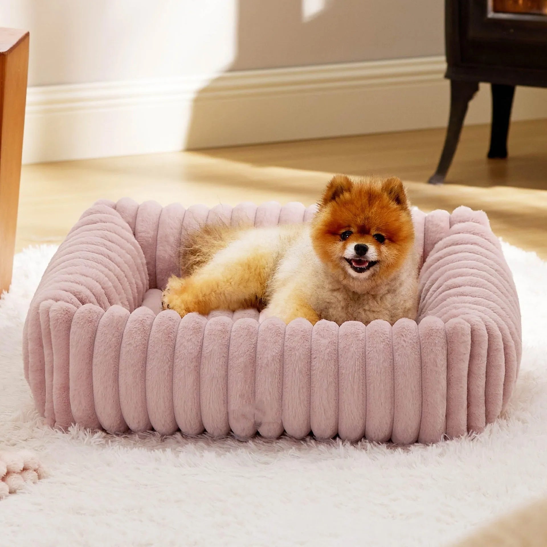 Dog bed with removable cover in beige colour showing four available size options