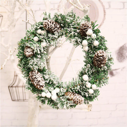 Festive Christmas wreath with artificial pine cones, berries, and maple leaves for elegant holiday decor