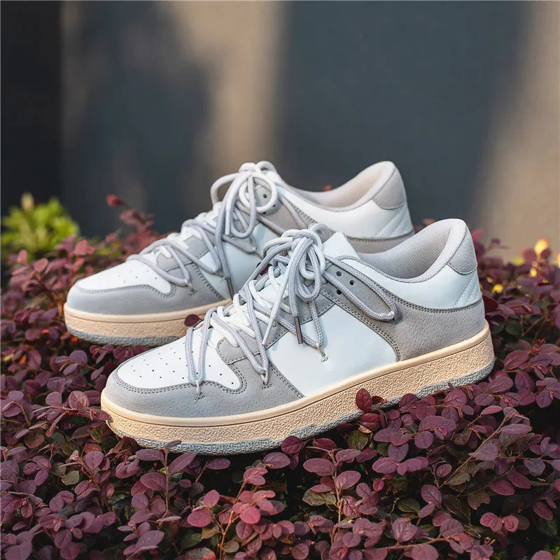 Men's low-top lace-up sneaker in beige with height increase, microfiber upper, and rubber sole on flat surface