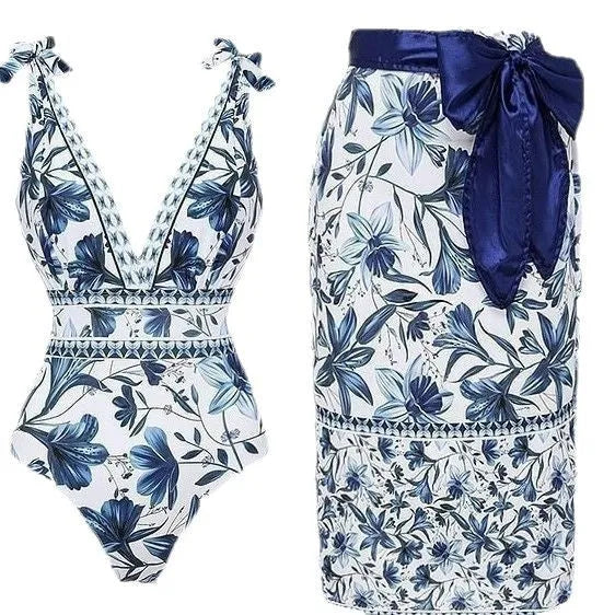 Women's printed one-piece swimsuit with sleeveless design, polyester fabric and optional matching skirt in sizes S to XL.
