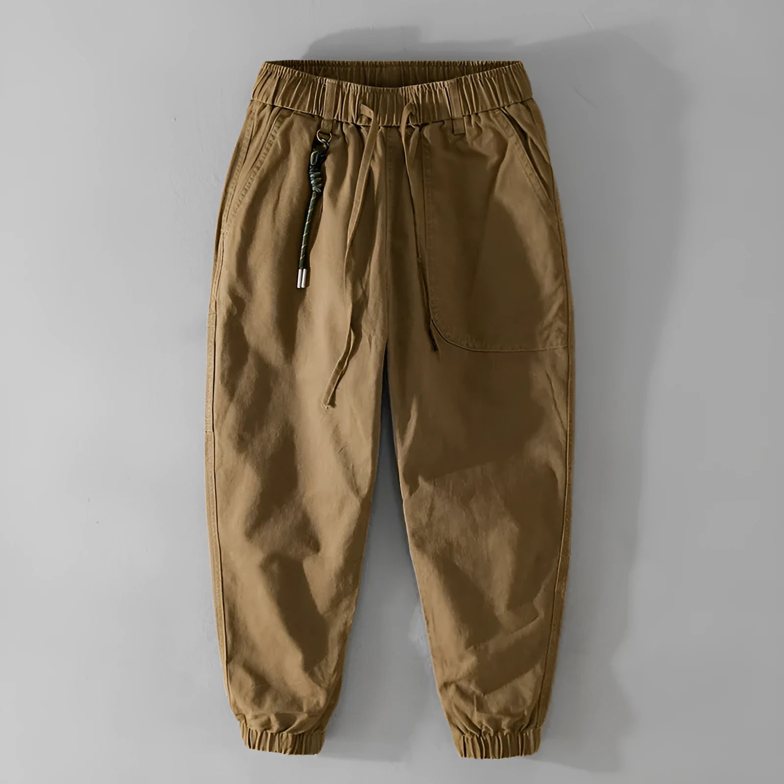 Men's Army Green cotton overalls with drawstring waist and banded ankles laid flat.