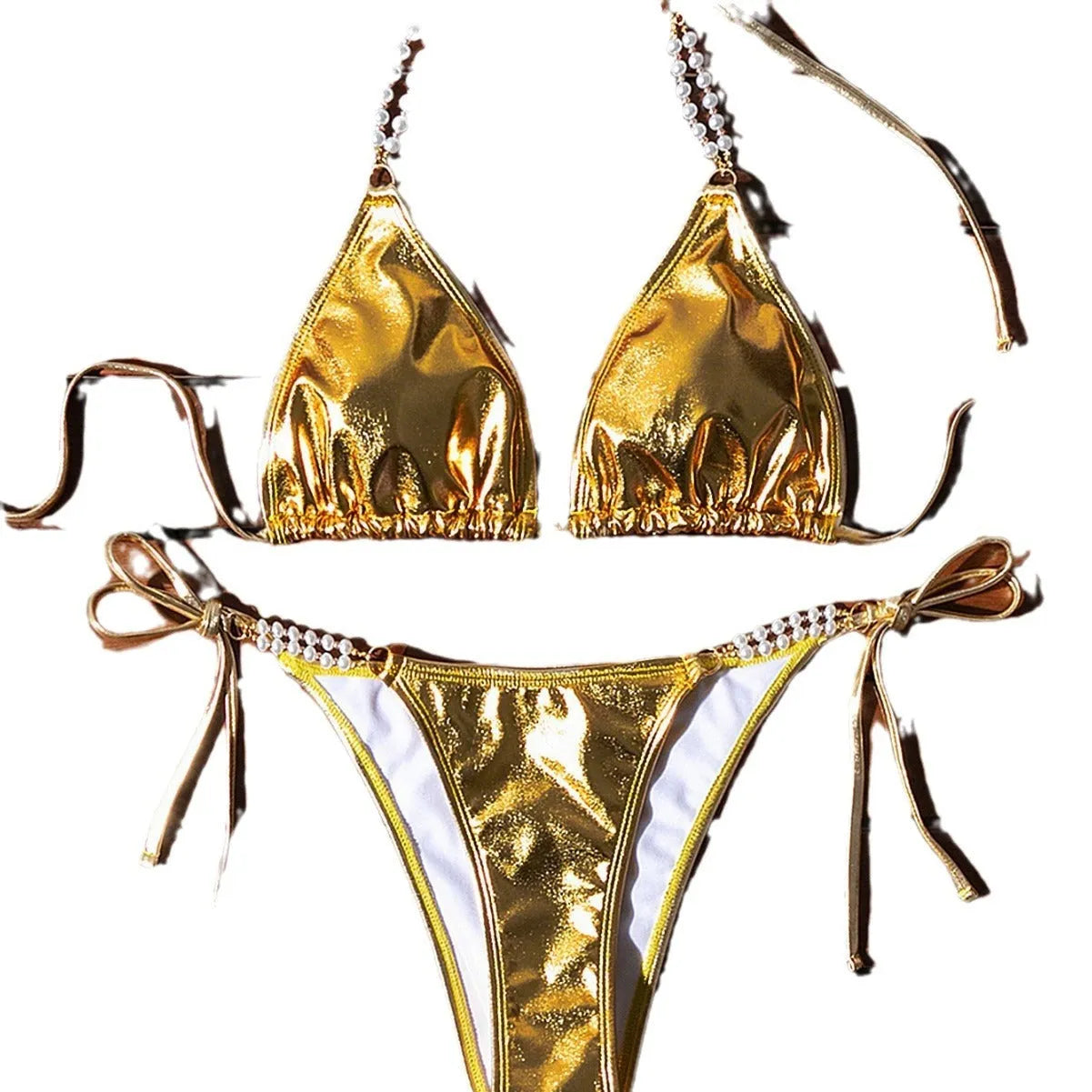 Gold halter neck bikini top with lace-up front and pearl chain, paired with brief-style bottoms