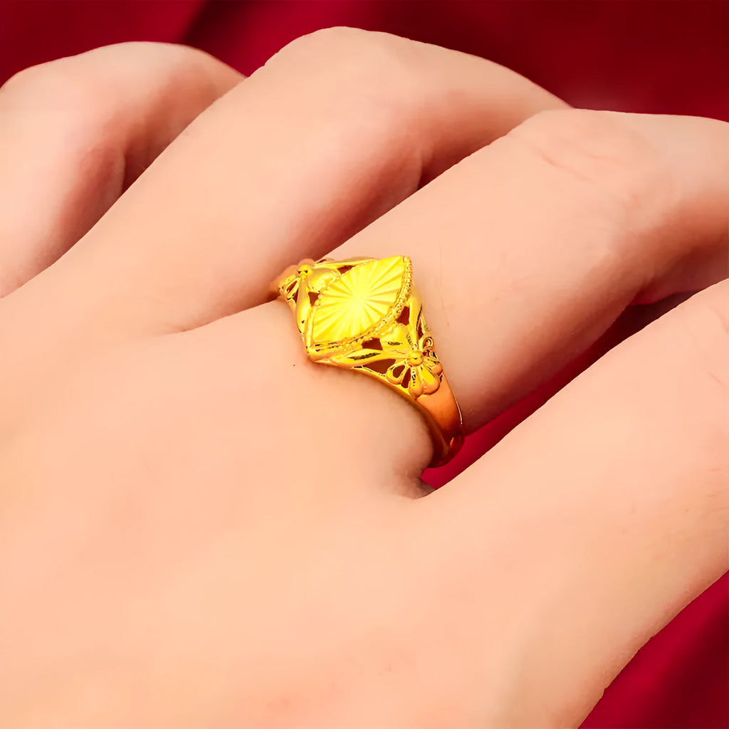 Gold coloured brass ring with open diamond flower design and geometric textured shape