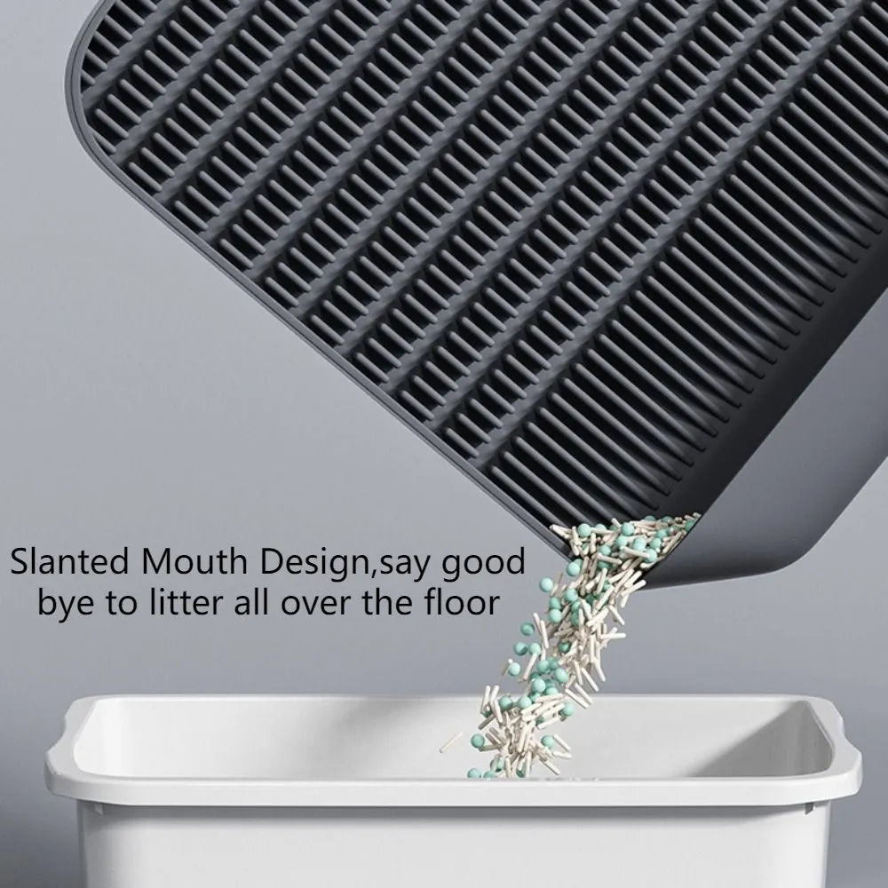 Large black cat litter pedal with slanted mouth design and textured surface for litter containment