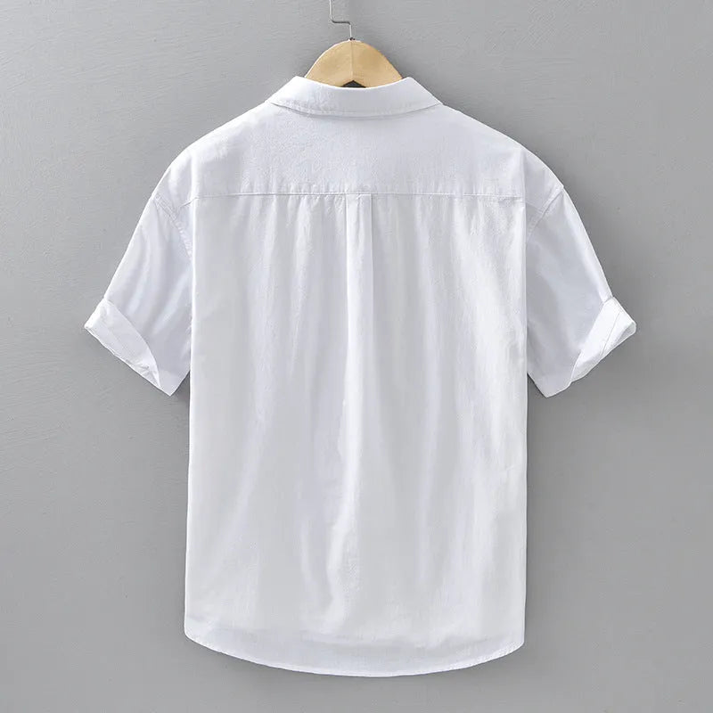 Men's loose-fitting short-sleeved cotton shirt in cardigan style shown in light grey colour