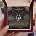 A hollow heart-shaped pendant necklace in a gold or silver finish, presented inside a gift box with a greeting card.