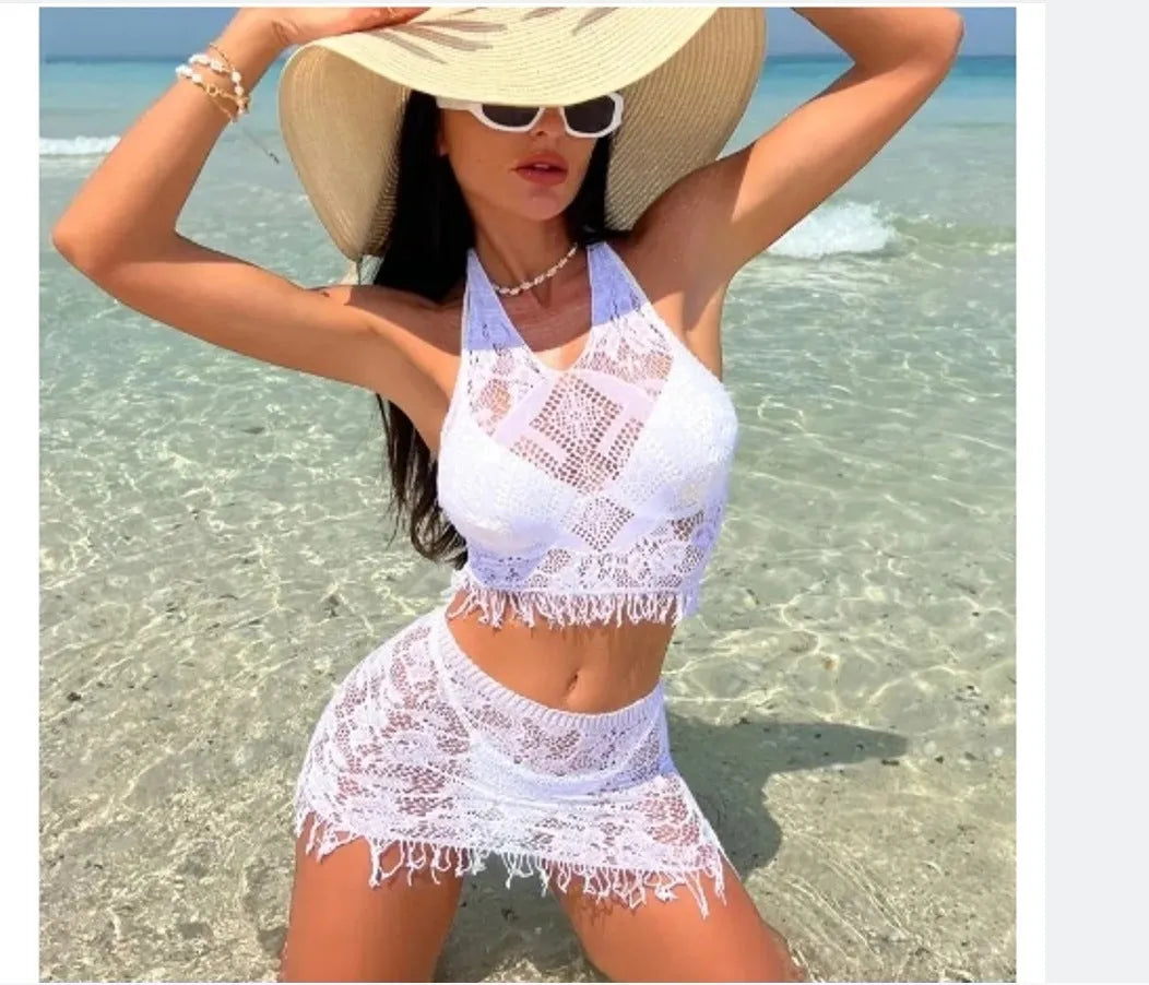 Women's white two-piece swimsuit with lace bikini top and tassel skirt beach cover-up