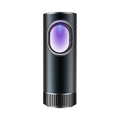 Black compact car air purifier with USB cable for formaldehyde removal and anion generation.