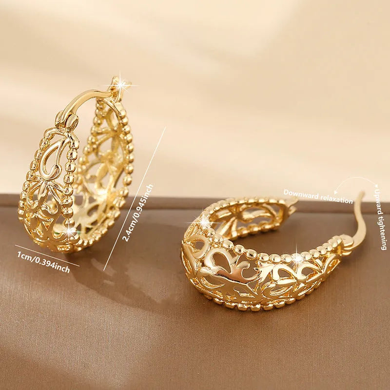 Pair of copper geometric earrings with round hollowed-out pattern in gold or silver, unisex style