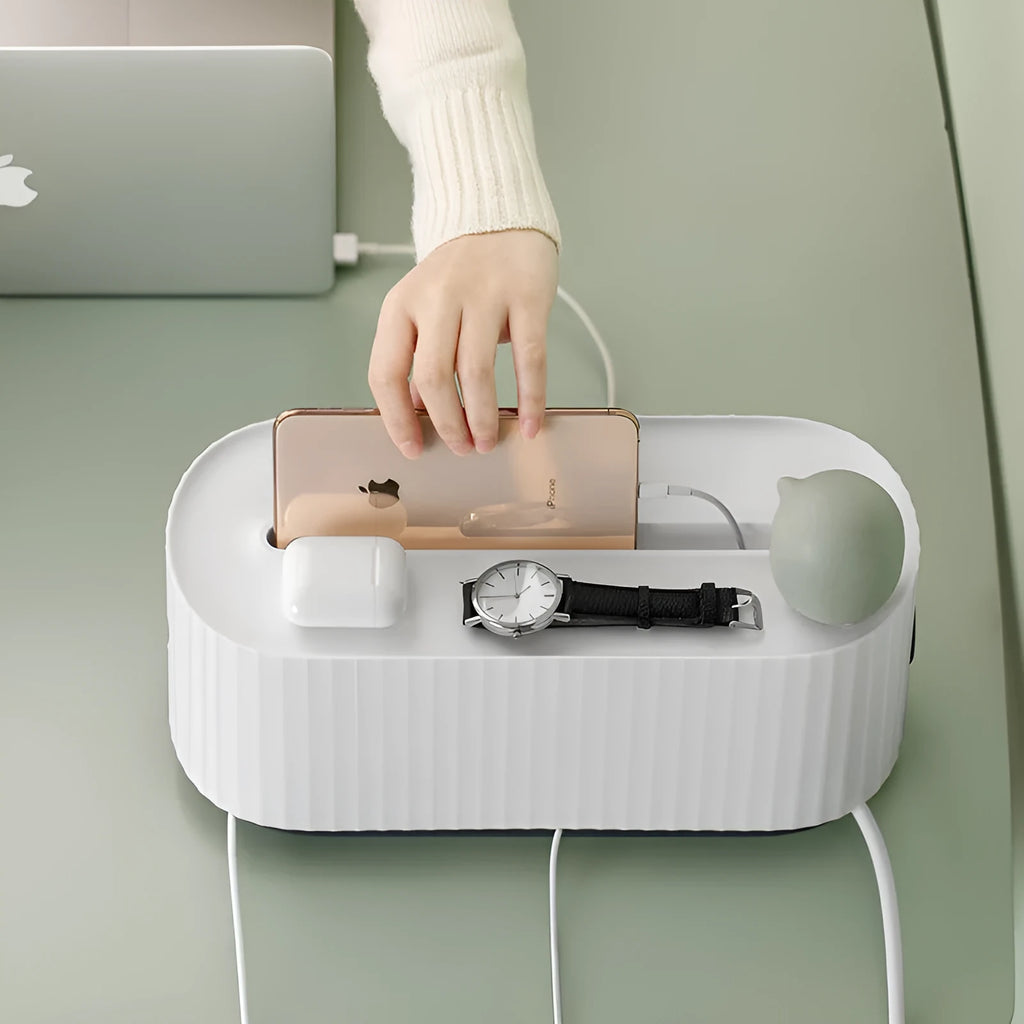 Blue and white HIPS plastic power strip storage box with lid open, showing phone slot and cable holes.