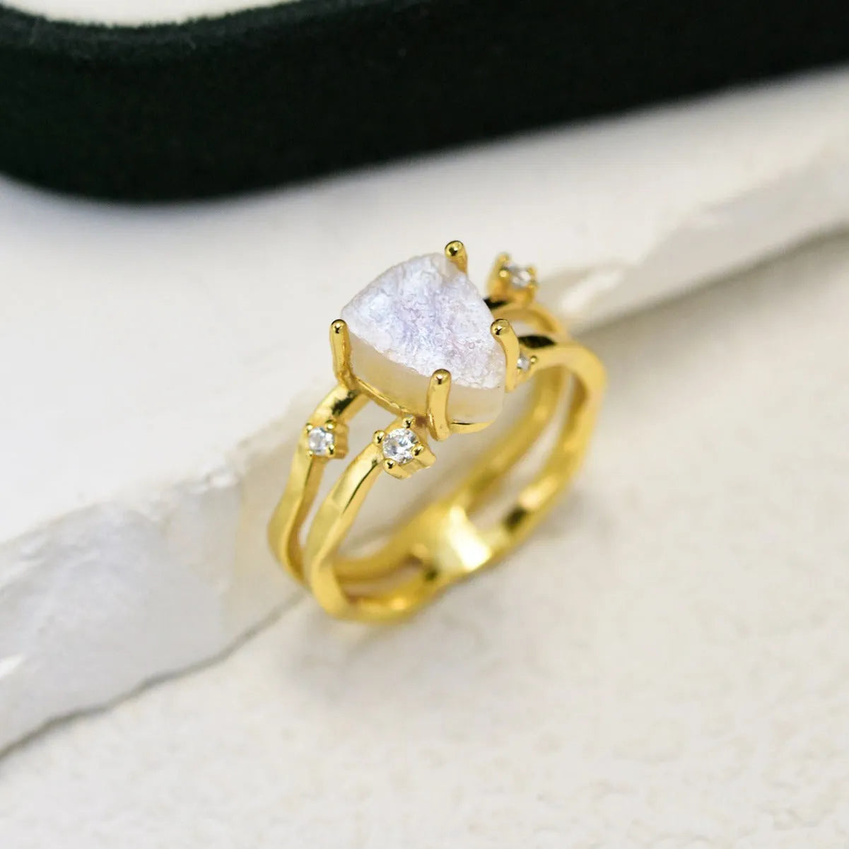 S925 silver irregular triangle ring with a moonstone, shown in rose gold, white gold, and yellow gold finishes.