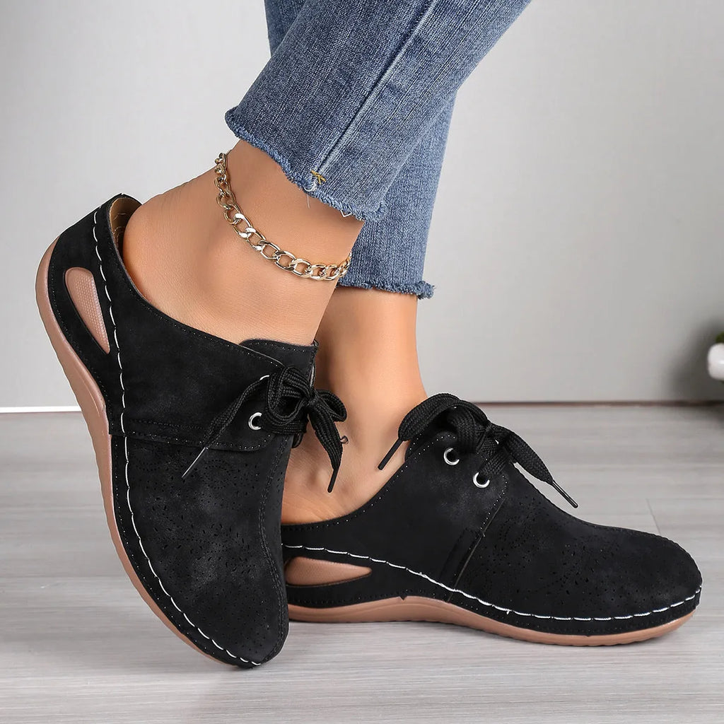 Women's suede lace-up wedge slippers in light grey with a hollow out design and rubber sole.