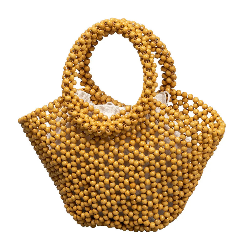 Hand-woven wooden bead beach handbag dumpling shape turmeric colour 13x7x18cm