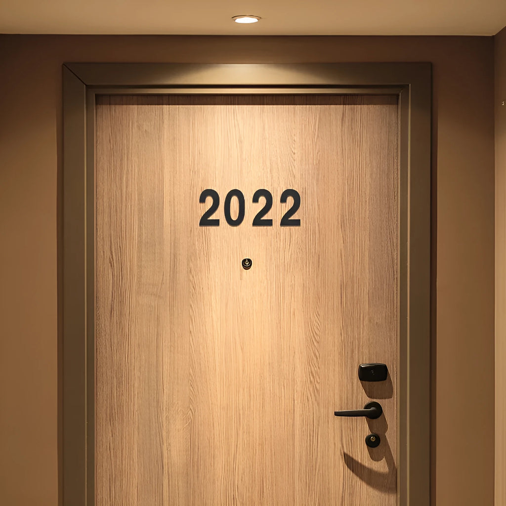 Black stainless steel sticky house numbers set showing characters A, B, 1, 2, 3 on adhesive backing.