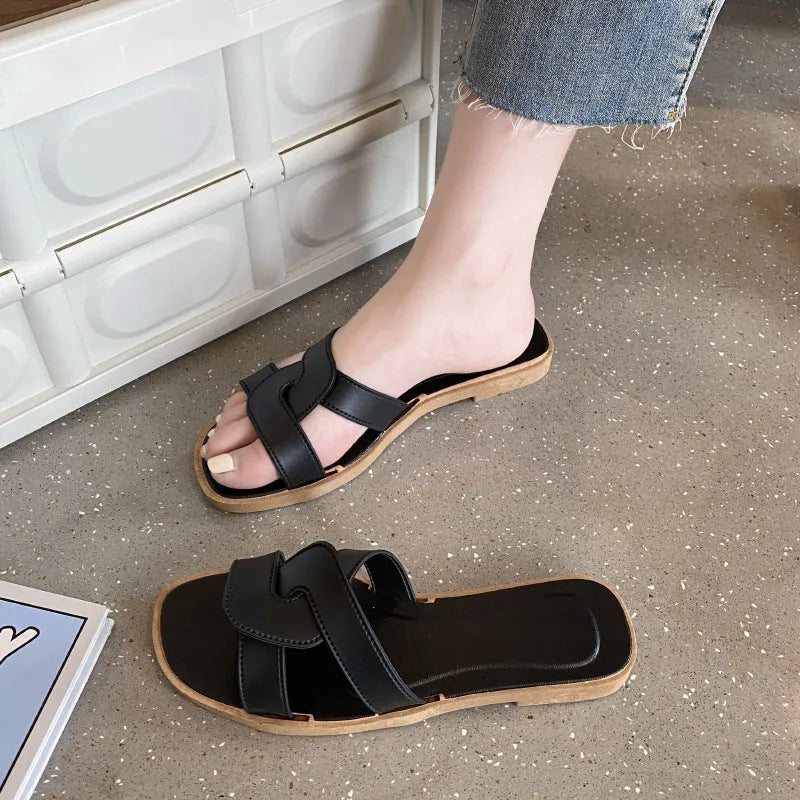 Women's cross strap PVC sandal in light blue with a toe ring and non-slip sole.