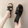 Women's cross strap PVC sandal in light blue with a toe ring and non-slip sole.
