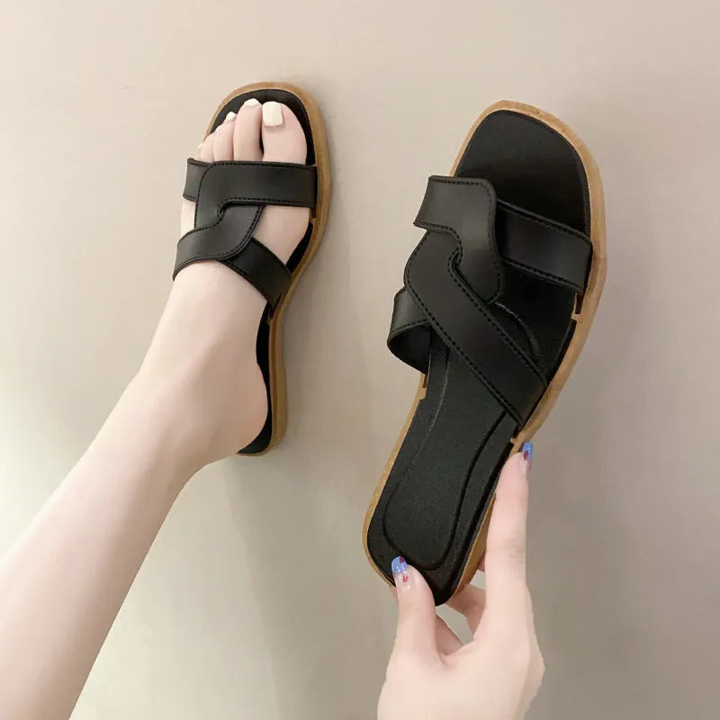 Women's cross strap PVC sandal in light blue with a toe ring and non-slip sole.