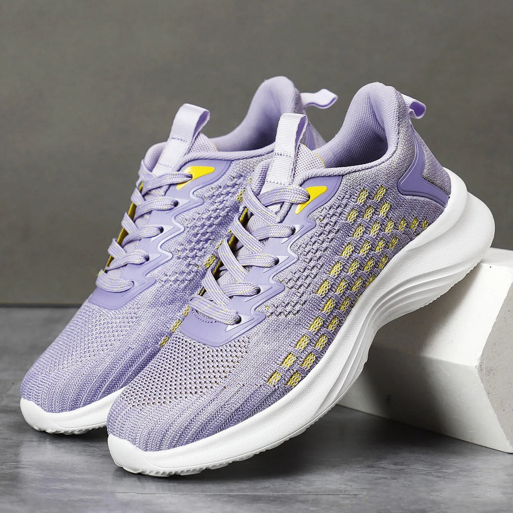 Women's lavender purple Flyknit running shoes with mesh lining and striped pattern, flat heel