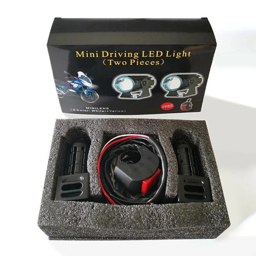 Motorcycle spotlight with dual-colour lens, aluminium housing, showing white and yellow light modes.