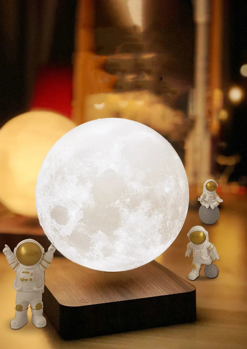 Maglev floating moon planet atmosphere night light with LED illumination on a desk.
