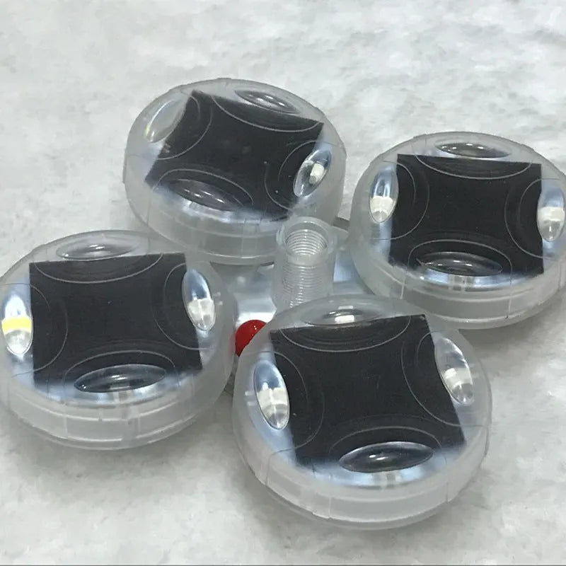 Colourful solar-powered LED valve light for mounting on a car or motorcycle wheel hub.