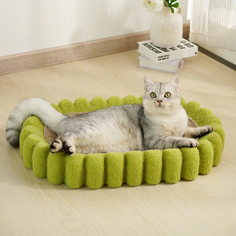Green oval cat scratcher pad with sisal surface serving as scratching area and cat bed