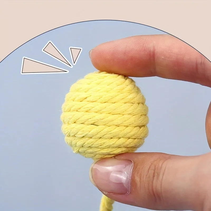 Colourful cat toy ball with attached rope and internal bell for kitten play