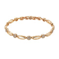 Golden copper hollow carved U-shaped bracelet for women on a plain background.