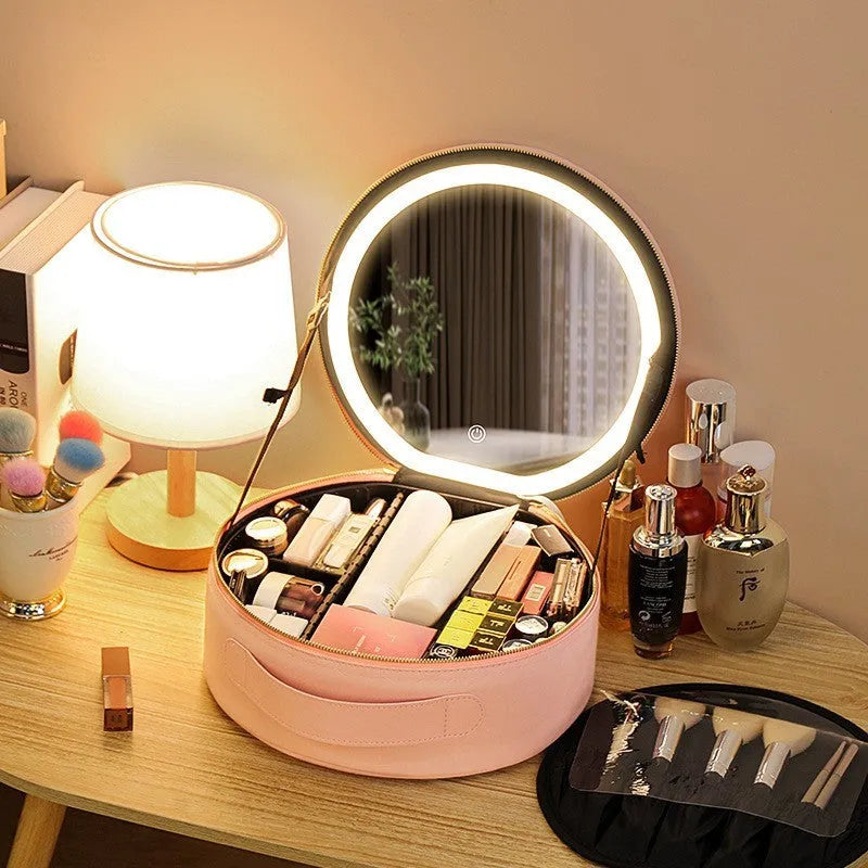 Round pink PU leather LED makeup bag open showing internal mirror, lights, and lattice partitions.