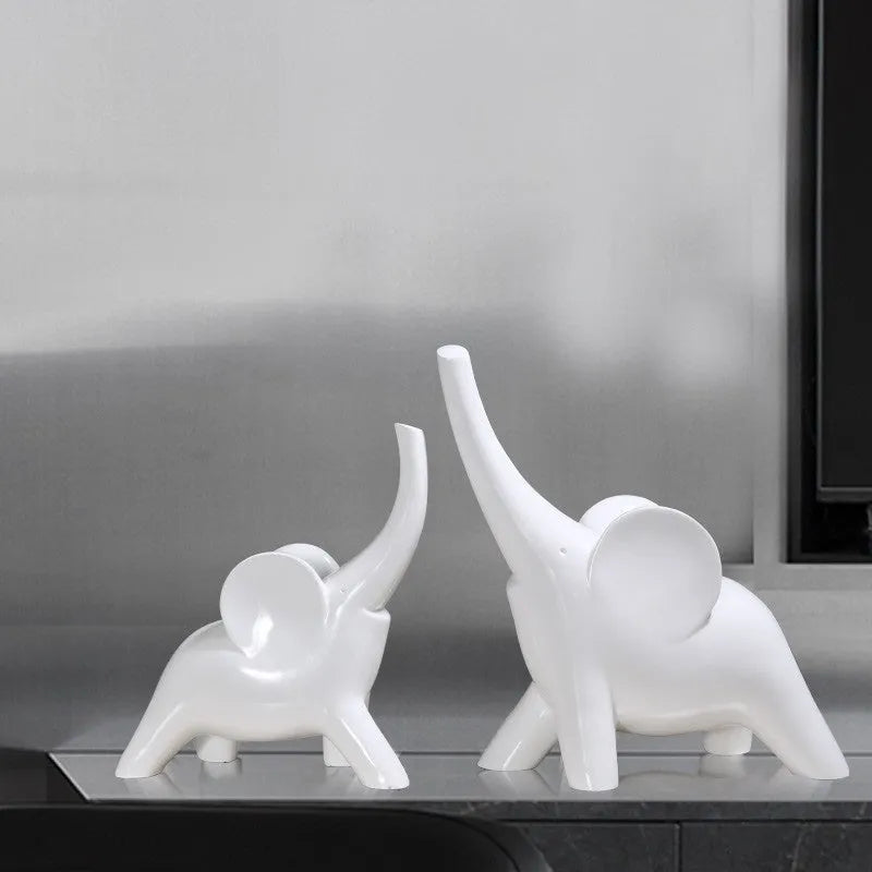 Modern simple style resin elephant ornament in rose gold or white, available in large and small sizes.