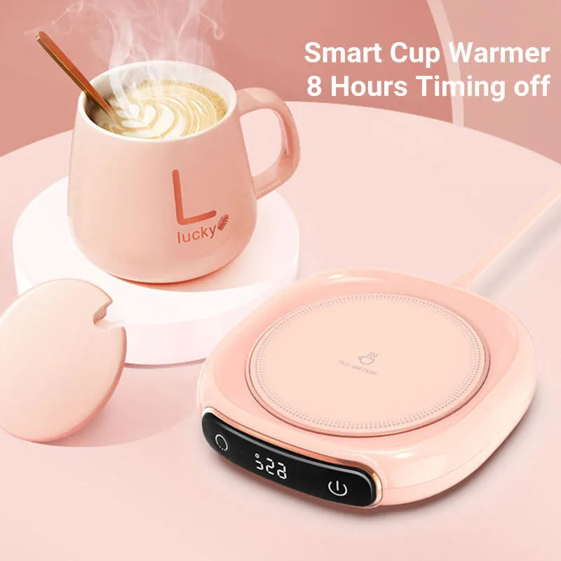 White USB-powered coffee mug warmer on desk heating a ceramic coffee cup