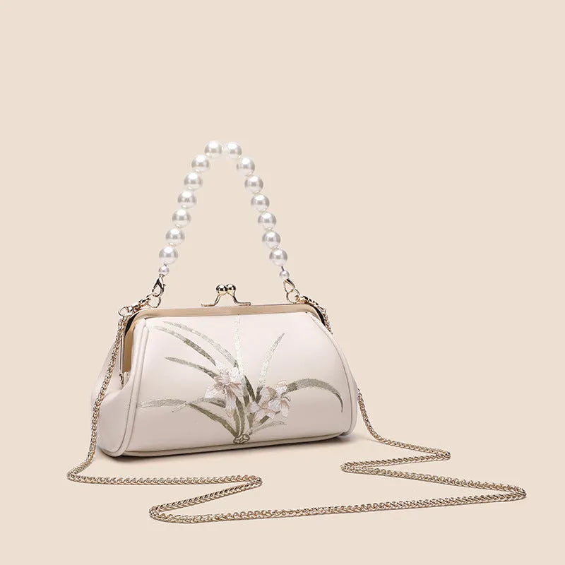 Beige embroidered women's shoulder bag with shell-shaped design in soft PU leather