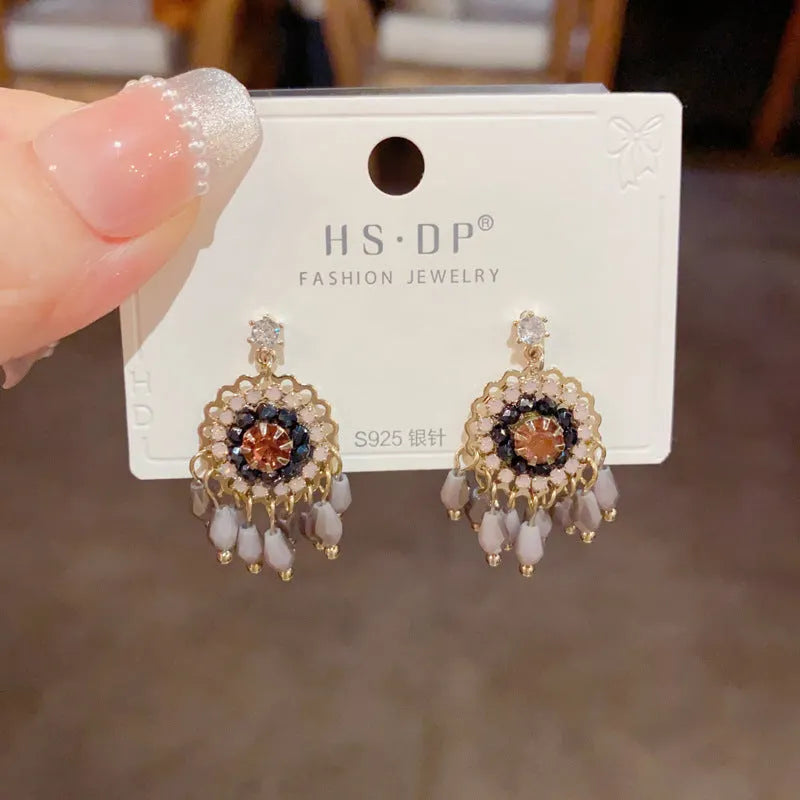 Geometric crystal tassel drop earrings with diamond embedded stones and thick gold plating
