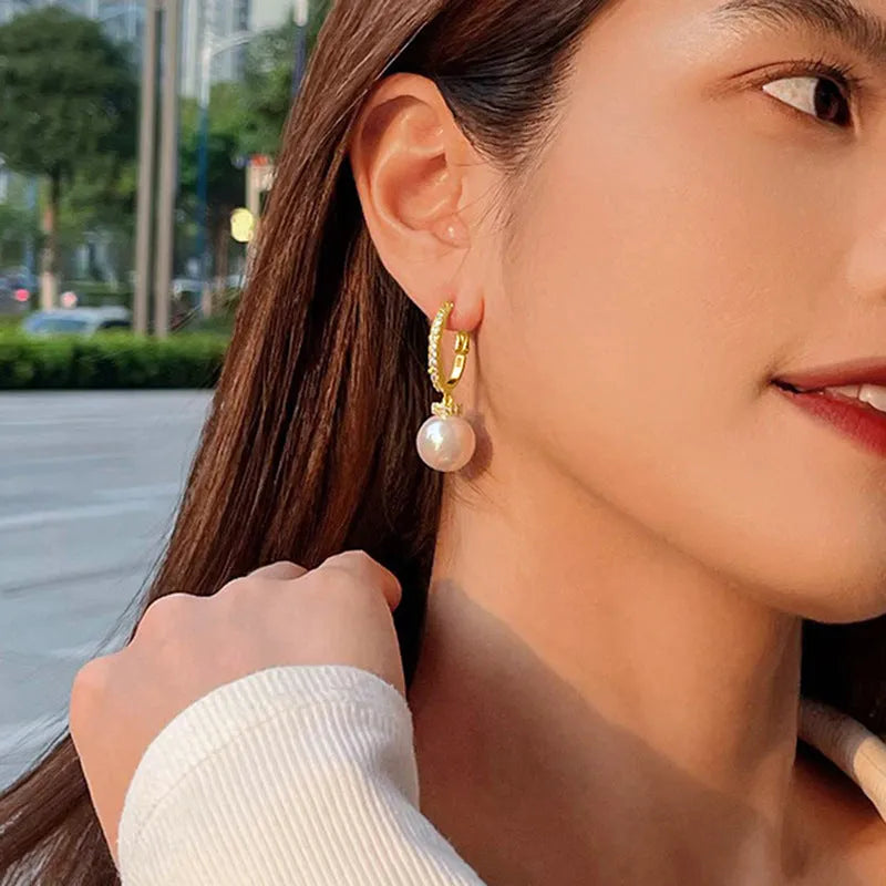 Yellow gold copper earrings with imitation pearl and inlaid zircon geometric ring design